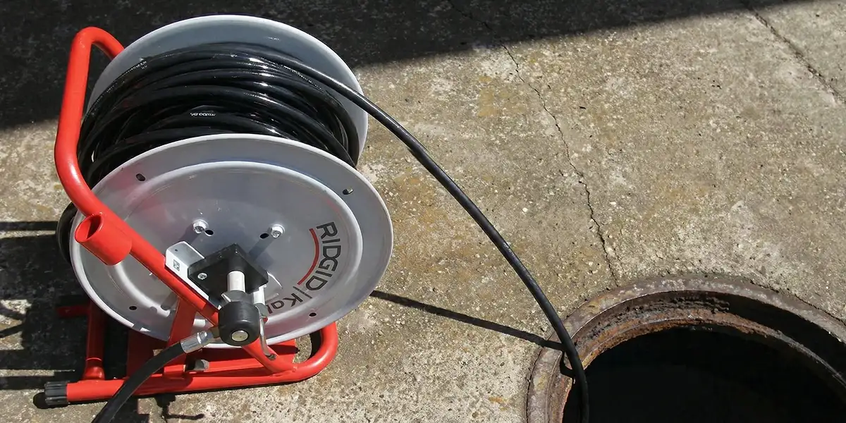 sewer rodding equipment prepared to clear clogged sewer lines in Aurora, CO