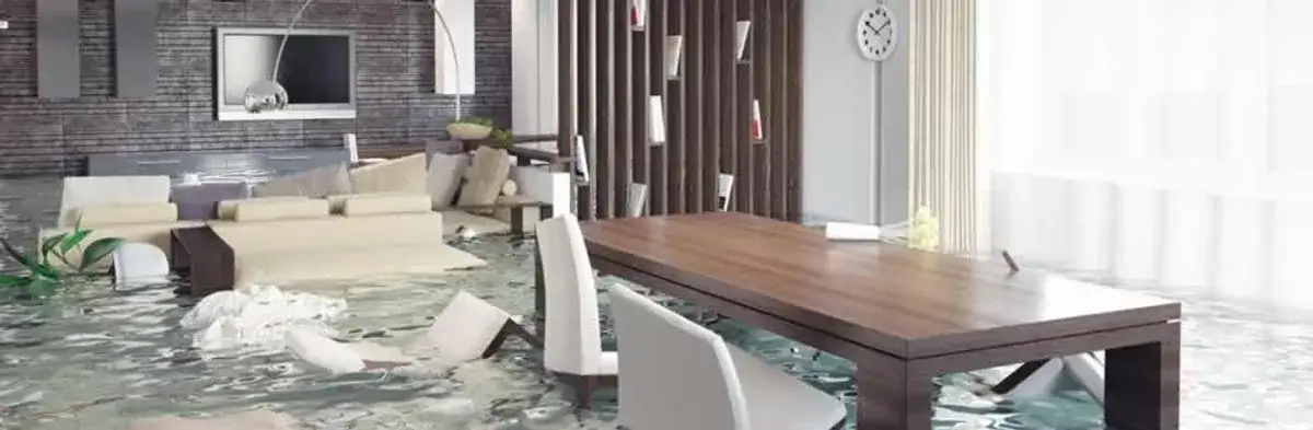 home interior affected by water damage with flooded floors and displaced furniture in Aurora, CO